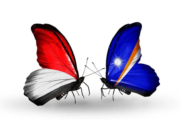 Butterflies with Monaco, Indonesia and Marshall islands flags on wings — Stock Photo, Image