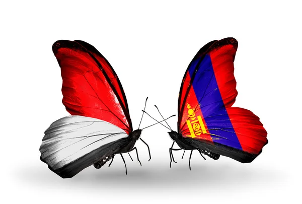 Butterflies with Monaco, Indonesia and Mongolia flags on wings — Stock Photo, Image