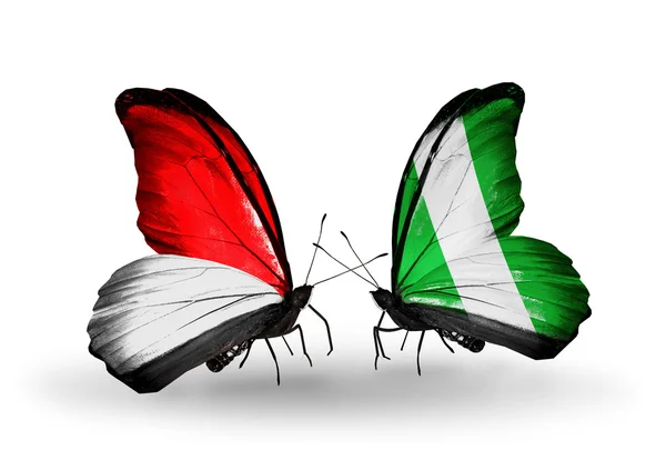Schmetterlinge mit Monaco, Indonesien und Nigeria Fahnen auf Flügeln — Stockfoto