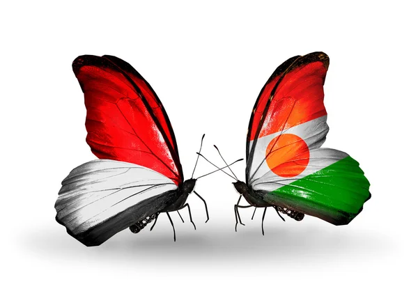 Butterflies with Monaco, Indonesia and Niger flags on wings — Stock Photo, Image