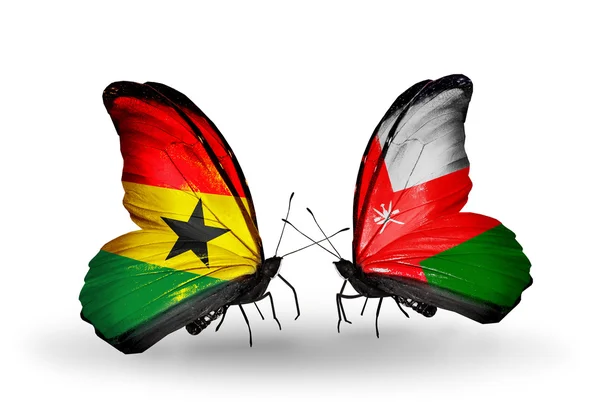 Бабочки с флажками Ганы и Омана на крыльях — стоковое фото