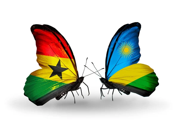 Mariposas con banderas de Ghana y Ruanda en alas — Foto de Stock