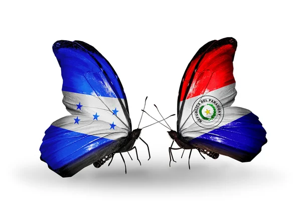 Mariposas con banderas de Honduras y Paraguay en alas — Foto de Stock