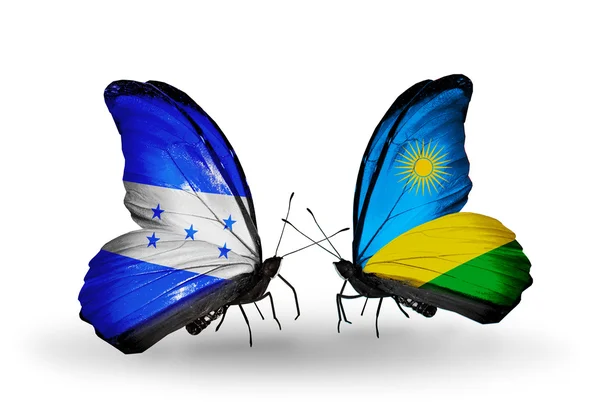 Papillons avec drapeaux Honduras et Rwanda sur les ailes — Photo