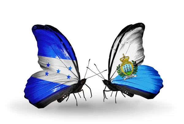 Papillons avec des drapeaux Honduras et Saint-Marin sur les ailes — Photo