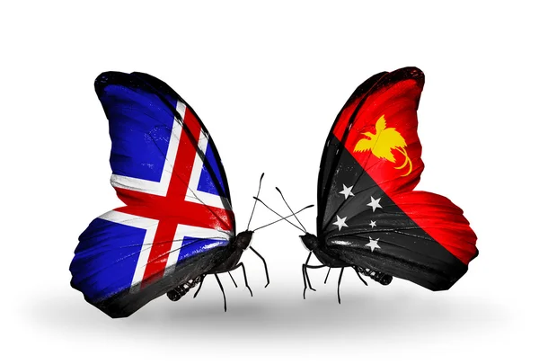 Farfalle con bandiere Islanda e Papua Nuova Guinea sulle ali — Foto Stock