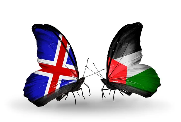Butterflies with Iceland and Palestine flags on wings — Stock Photo, Image