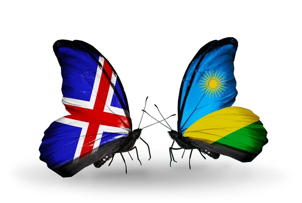 Butterflies with Iceland and Rwanda flags on wings — Stock Photo, Image