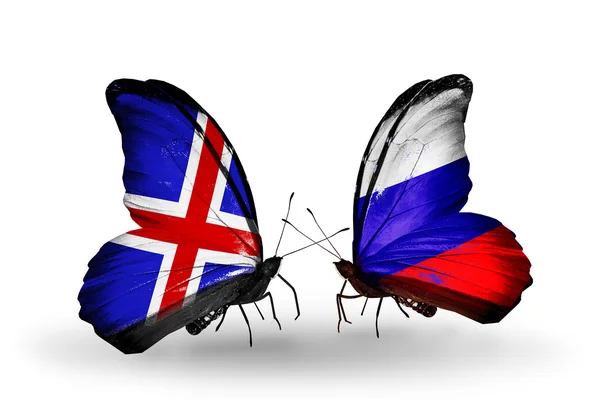 Mariposas con banderas de Islandia y Rusia en alas — Foto de Stock