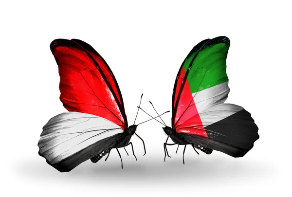 Mariposas con banderas de Mónaco, Indonesia y Emiratos Árabes Unidos en alas — Foto de Stock
