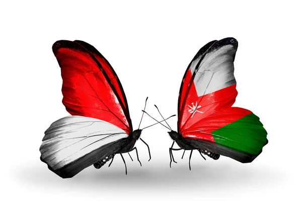 Mariposas con banderas de Mónaco, Indonesia y Omán en alas — Foto de Stock