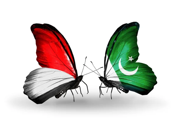 Papillons avec des drapeaux Monaco, Indonésie et Pakistan sur les ailes — Photo
