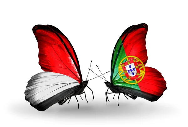 Butterflies with Monaco, Indonesia and Portugal flags on wings — Stock Photo, Image