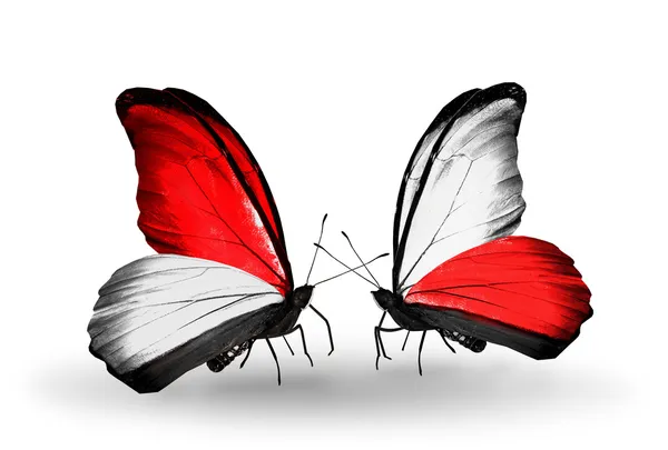 Schmetterlinge mit Monaco, Indonesien und Polenfahnen auf Flügeln — Stockfoto
