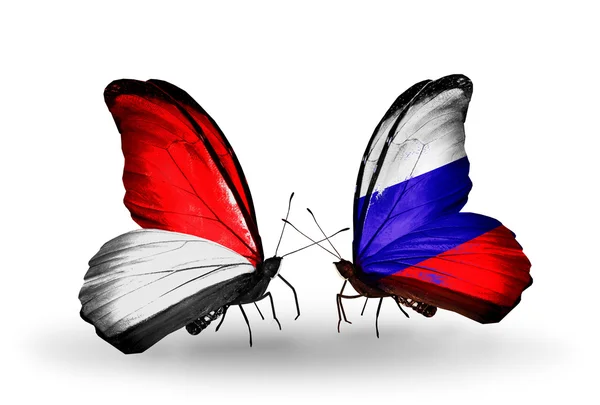 Butterflies with Monaco, Indonesia and Russia flags on wings — Stock Photo, Image