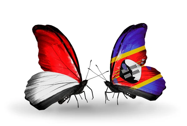 Farfalle con le bandiere di Monaco, Indonesia e Swaziland sulle ali — Foto Stock