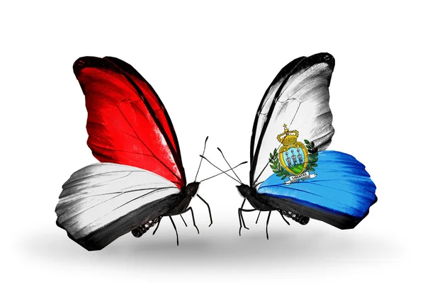 Butterflies with Monaco, Indonesia and  San Marino flags on wings — Stock Photo, Image