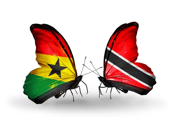 Papillons avec drapeaux Ghana et Trinité-et-Tobago sur les ailes — Photo