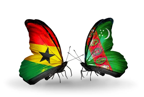 Borboletas com bandeiras do Gana e do Turquemenistão em asas — Fotografia de Stock