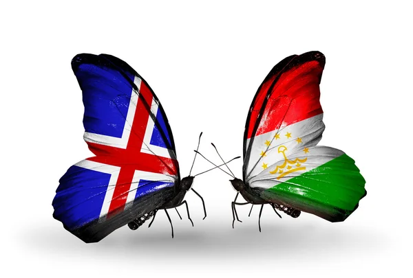 Butterflies with Iceland and Tajikistan flags on wings — Stock Photo, Image