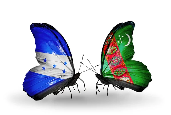 Butterflies with Honduras and  Turkmenistan flags on wings — Stock Photo, Image