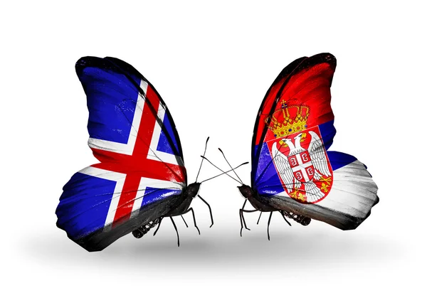 Butterflies with Iceland and Serbia flags on wings — Stock Photo, Image
