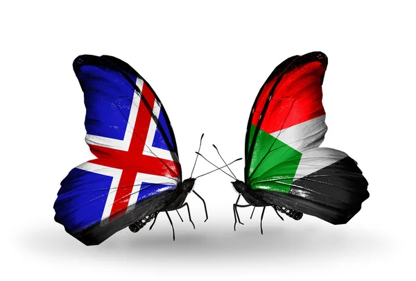Butterflies with Iceland and Sudan flags on wings — Stock Photo, Image