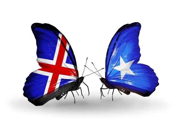 Vlinders met IJsland en Somalië vlaggen op vleugels — Stockfoto