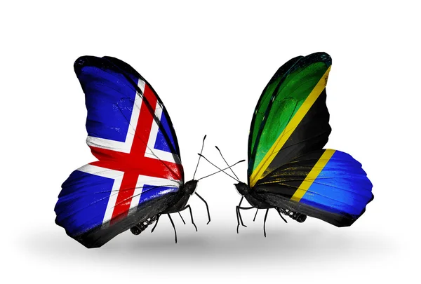 Kelebek kanatları üzerinde İzlanda ve Tanzanya bayraklı — Stok fotoğraf