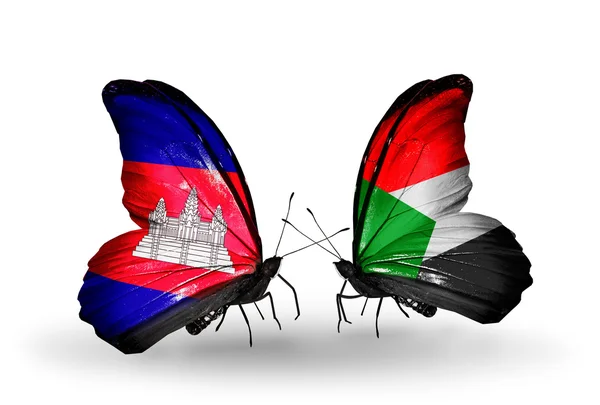 Schmetterlinge mit Kambodscha und Sudan-Flaggen auf Flügeln — Stockfoto