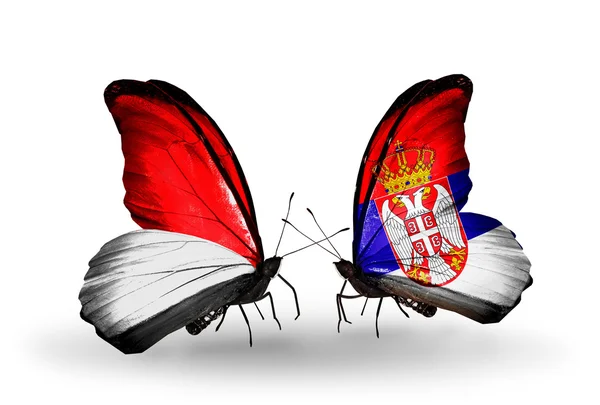 Butterflies with Monaco, Indonesia and Serbia flags on wings — Stock Photo, Image