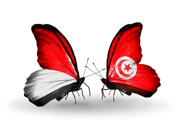 Farfalle con le bandiere di Monaco, Indonesia e Tunisia sulle ali — Foto Stock