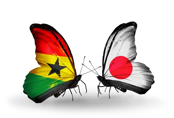 Kelebekler kanat Japonya ve Gana bayrakları ile — Stok fotoğraf