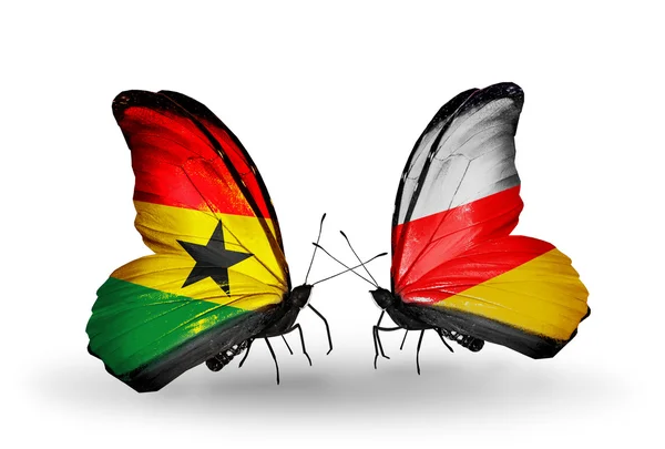 Butterflies with Ghana and South Ossetia flags on wings — Stock Photo, Image