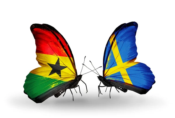 Motyle z Ghany i Szwecji flagi na skrzydłach — Zdjęcie stockowe