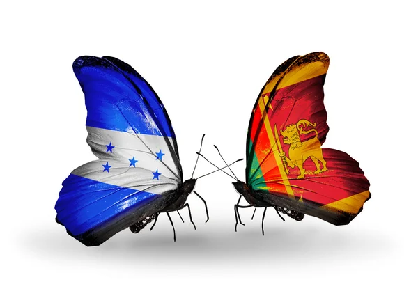 Papillons avec des drapeaux Honduras et Sri Lanka sur les ailes — Photo