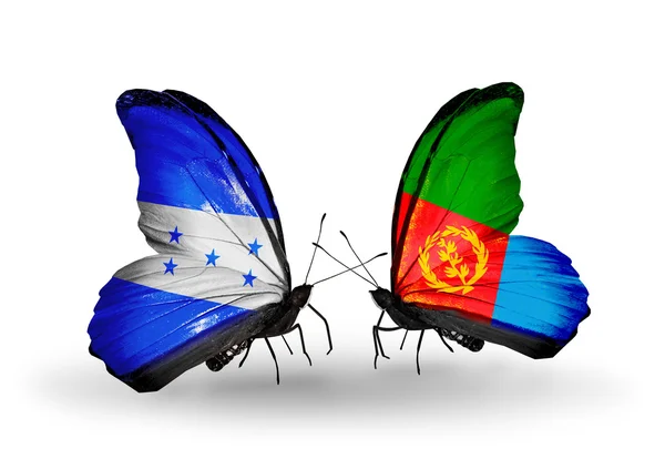 Kelebek kanatları üzerinde honduras ve Eritre bayraklı — Stok fotoğraf
