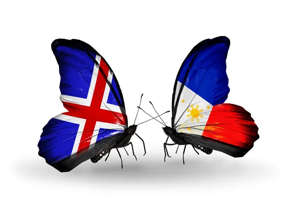 Butterflies with Iceland and Philippines flags on wings — Stock Photo, Image