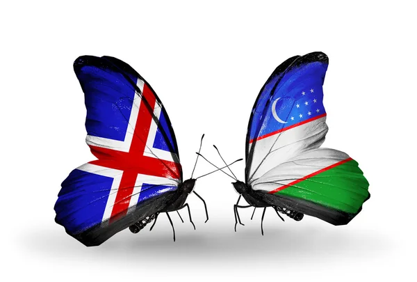 Butterflies with Iceland and Uzbekistan flags on wings — Stock Photo, Image