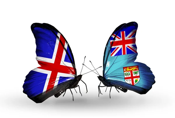 Butterflies with Iceland and Fiji flags on wings — Stock Photo, Image