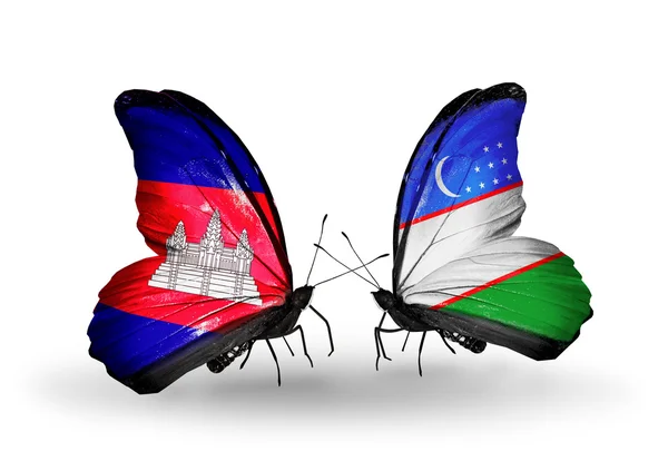 Butterflies with Cambodia and  Uzbekistan flags on wings — Stock Photo, Image