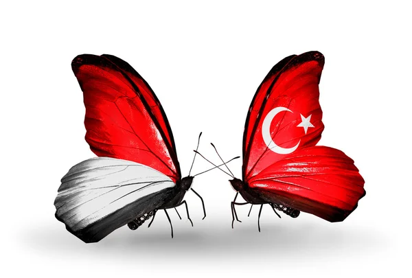 Butterflies with Monaco, Indonesia and Turkey flags on wings — Stock Photo, Image