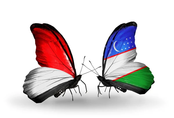 Butterflies with  Monaco, Indonesia and Uzbekistan flags on wings — Stock Photo, Image