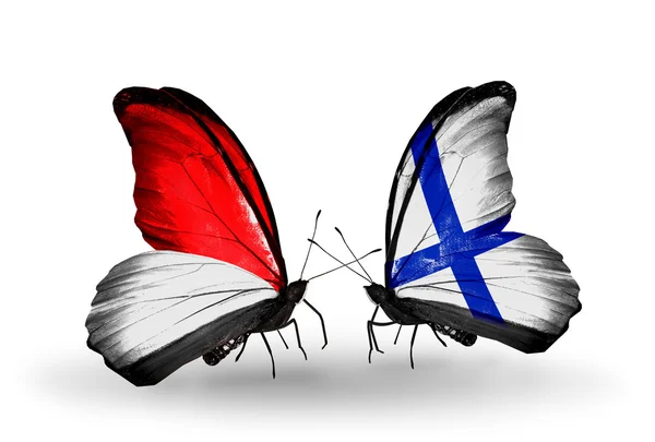 Butterflies with Monaco, Indonesia and Finland flags on wings — Stock Photo, Image