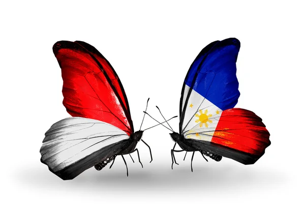 Papillons avec des drapeaux Monaco, Indonésie et Philippines sur les ailes — Photo