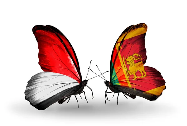 Бабочки с флагами Монако, Индонезии и Шри-Ланки на крыльях — стоковое фото
