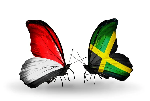 Vlinders met monaco, Indonesië en jamaica vlaggen op vleugels — Stockfoto