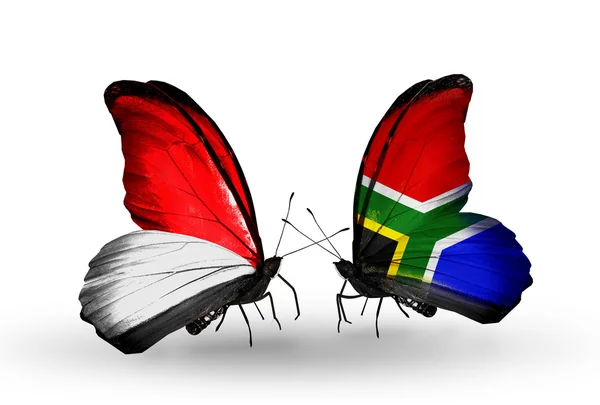 Butterflies with Monaco, Indonesia and  South Africa flags on wings — Stock Photo, Image