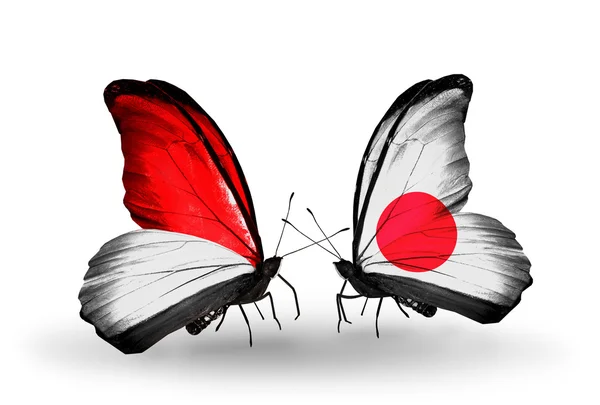 Schmetterlinge mit Monaco, Indonesien und Japan-Flaggen — Stockfoto