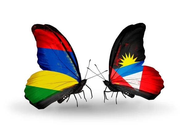 Motyle z flagami mauritius i Antigui i Barbudy — Zdjęcie stockowe